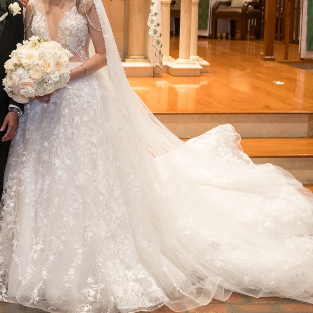 Bridal Wedding Dress. White lace and 3D floral applications.